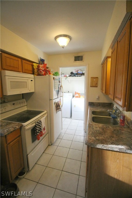 Kitchen leads into laundry room and back door