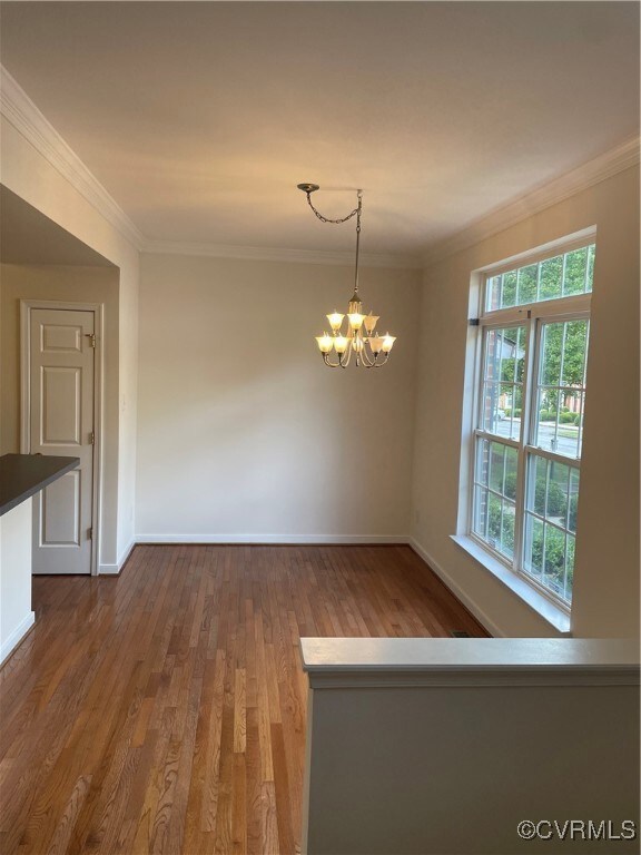 Formal dining area featuring wood-type flooring, a
