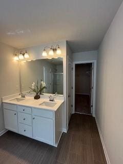 Full bathroom with a sink, baseboards, double vani