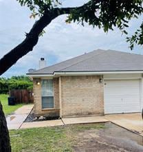 Back of property featuring concrete driveway and 