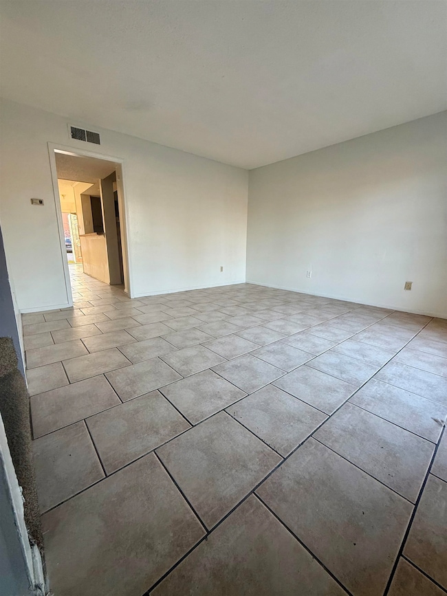 Spare room with tile patterned floors