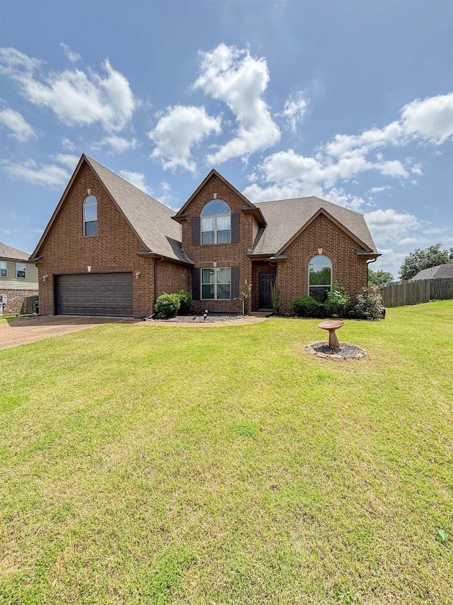 Traditional-style house featuring brick siding, dr
