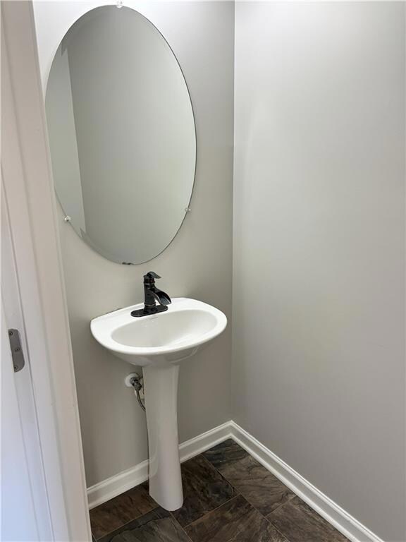 Bathroom featuring baseboards