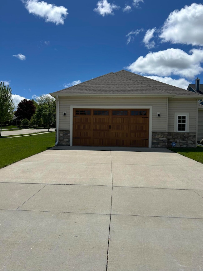 Upgraded garage doors and concrete drive