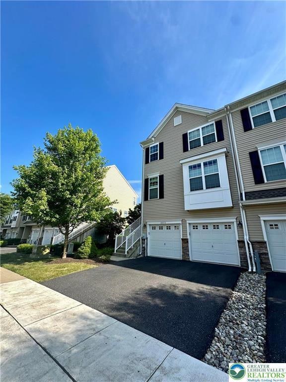 2 car garage with driveway parking
