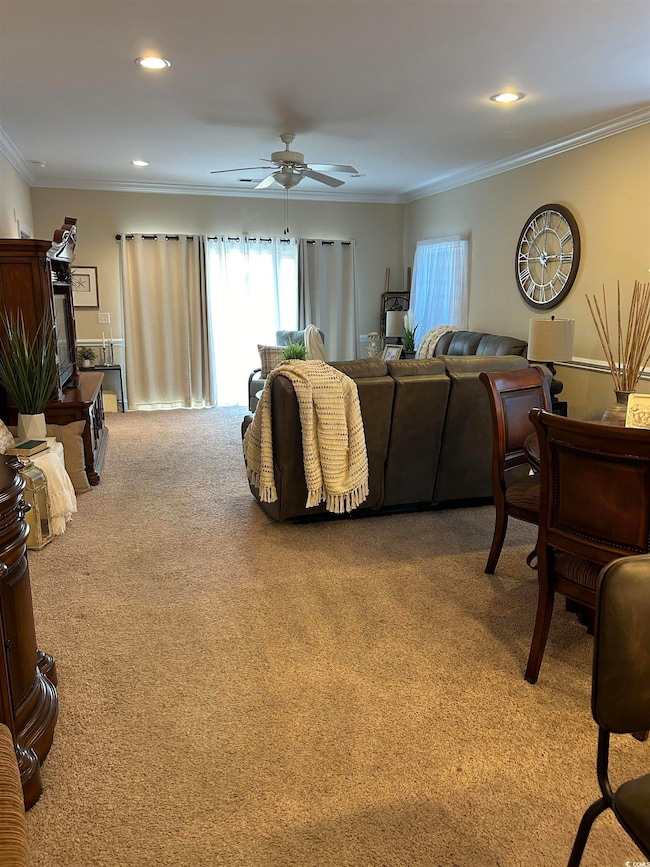 Living room featuring carpet floors, recessed ligh