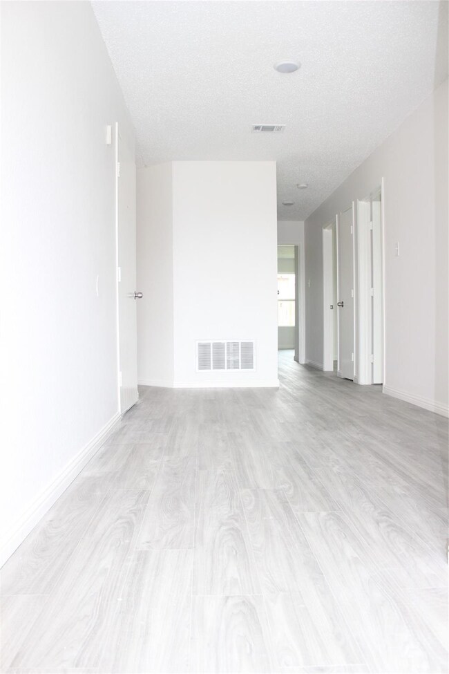 Spare room featuring a textured ceiling