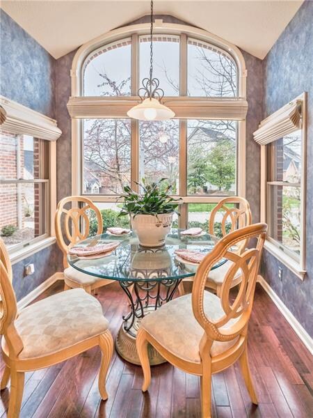 Kitchen/breakfast nook surrounded by windows offer