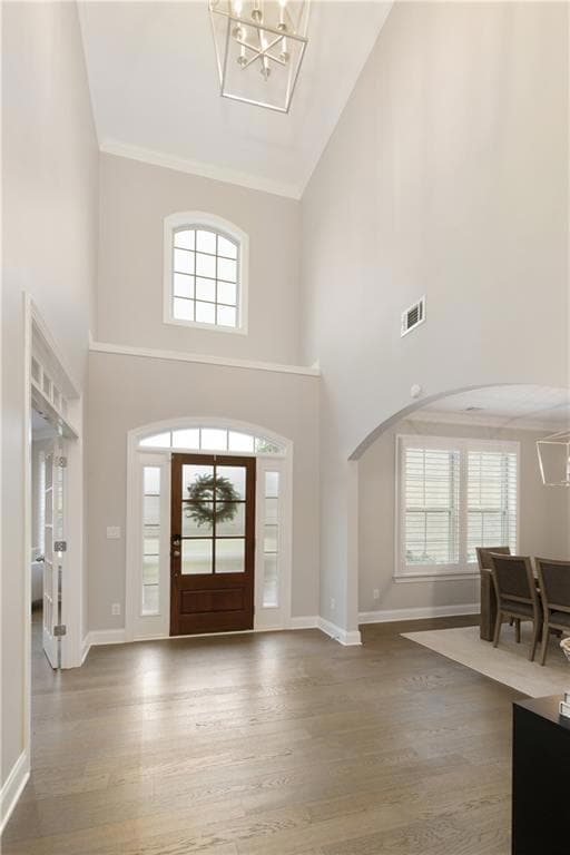 Grand two-story foyer featuring wide-planked hardw