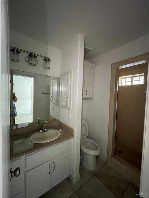 Full bathroom with tile patterned flooring, vanity, and a stall shower
