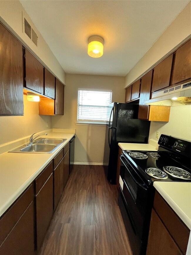 Here is a full view of this kitchen. Notice the natural lighting coming in from the window.