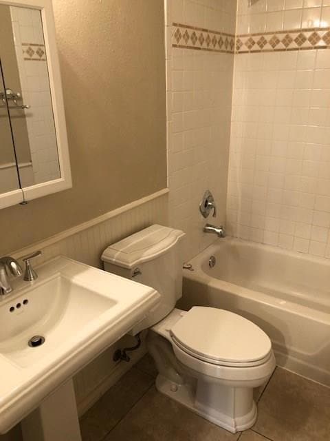Bathroom with shower / tub combination, wainscoti