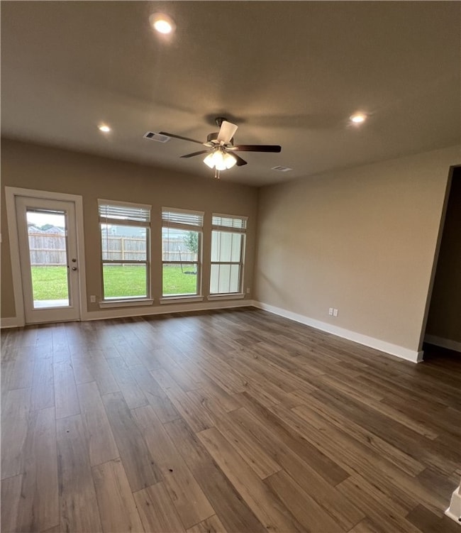 Unfurnished room with plenty of natural light, dar