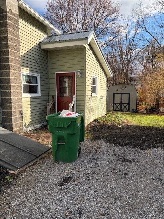Side of house where the Bilco door is & shed