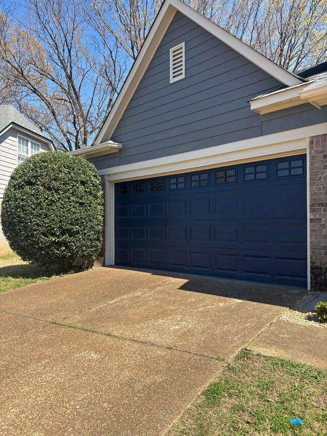 Garage with concrete driveway