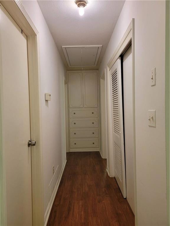 Corridor featuring dark hardwood / wood-style floo