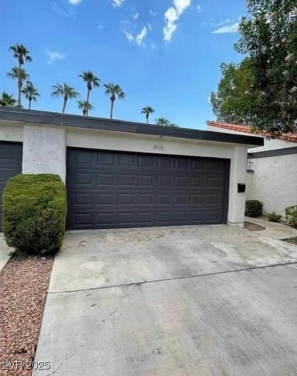 Garage featuring driveway