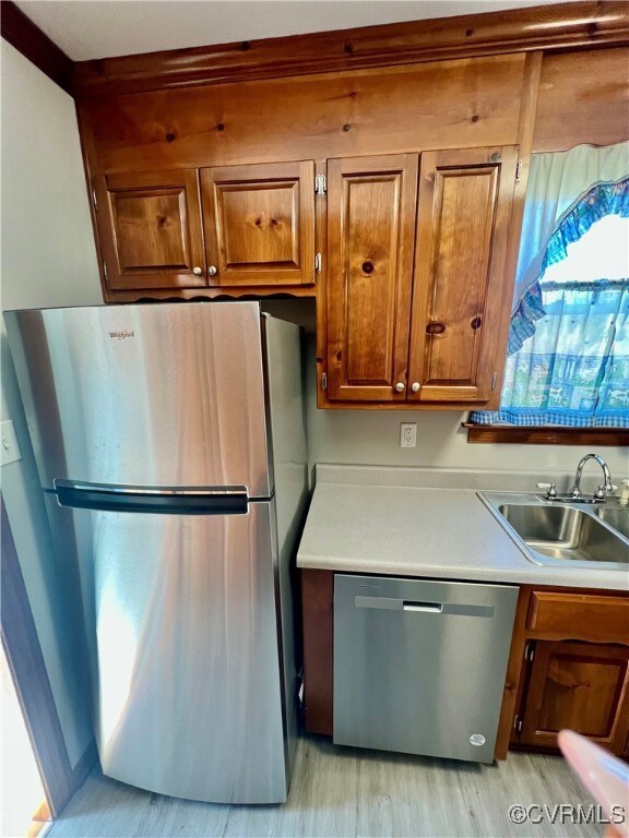 Kitchen featuring sink, appliances with stainless
