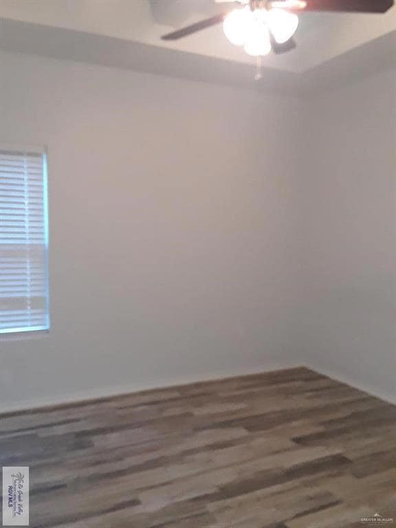 Spare room with ceiling fan and wood finished floors