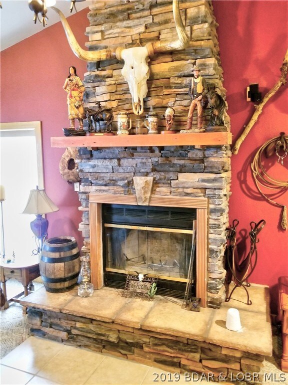 Wood burning fireplace in the game room. All the large windows have wide window sills covered with rock. Special touches everywhere.