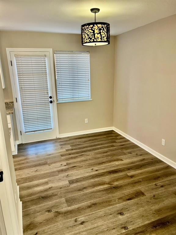 Unfurnished dining area with hardwood / wood-style