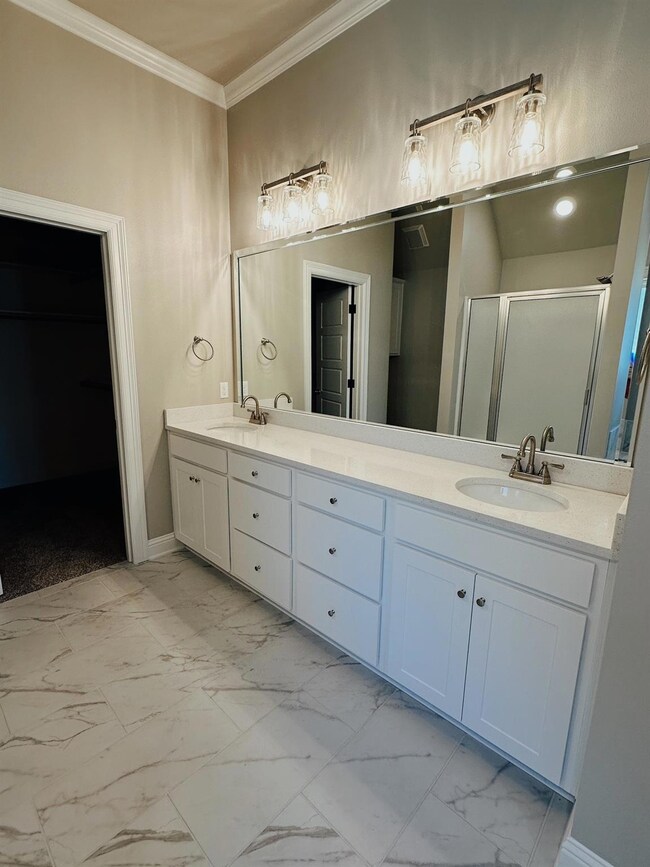 Bathroom featuring tile flooring, oversized vanity