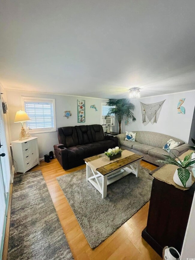 Living room with light wood-type flooring