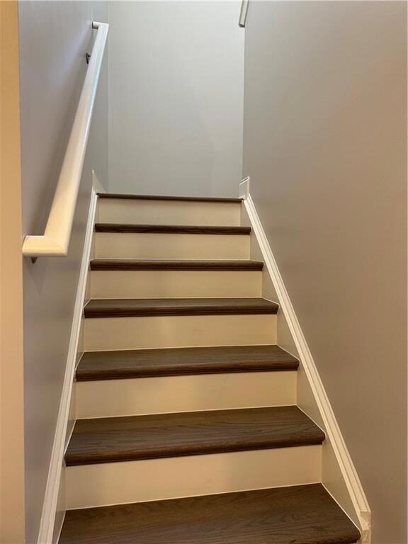 Stairway with wood finished floors