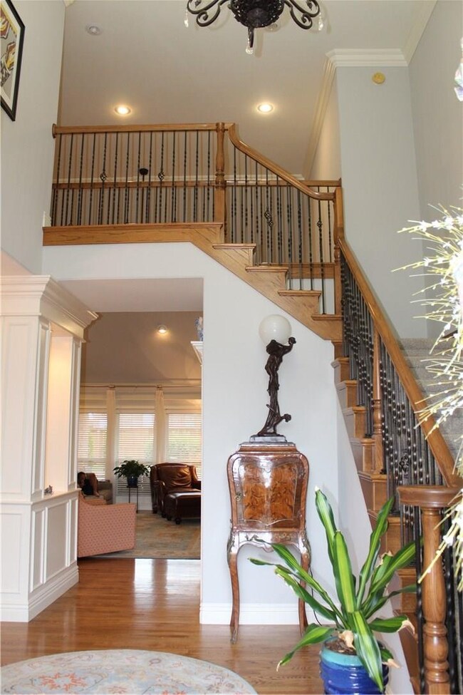 Welcoming foyer with staircase made for elegant portraits