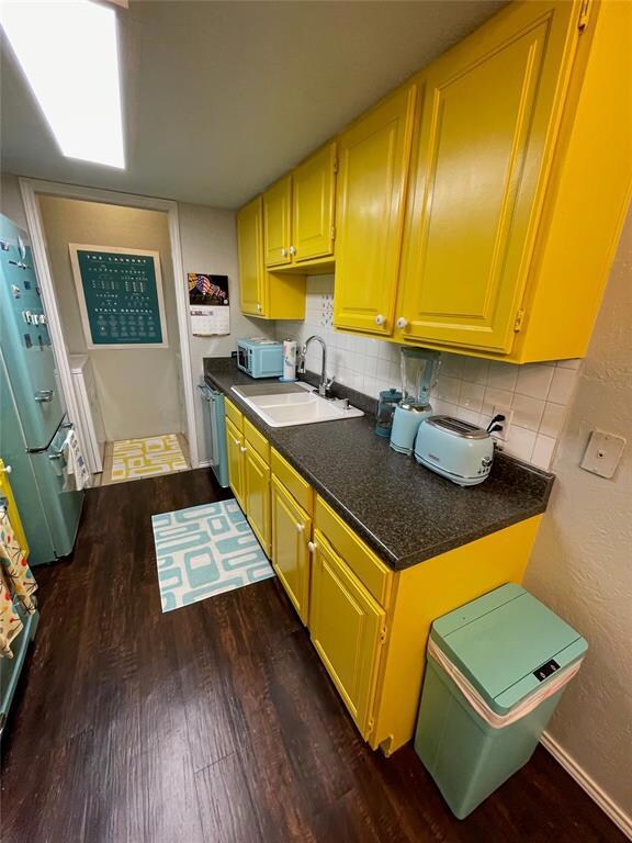 Kitchen featuring sink, dark hardwood / wood-style