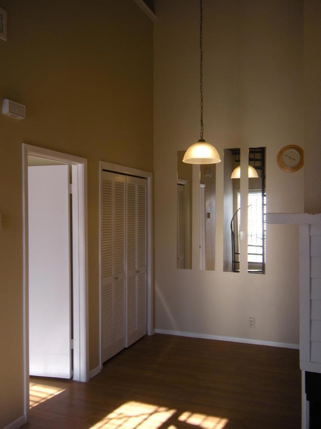 Unfurnished dining area with baseboards, wood fin