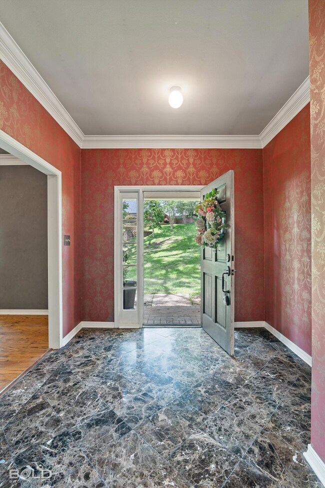 Unfurnished room featuring dark tile flooring and 