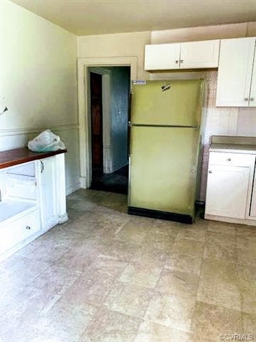 kitchen: eat-in space on left side of room, chair rail molding, door leads to hallway & front living room
