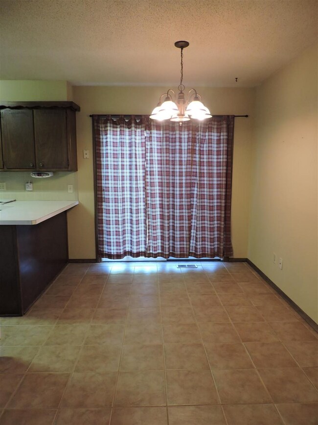 Dining area has glass sliding door to the backyard