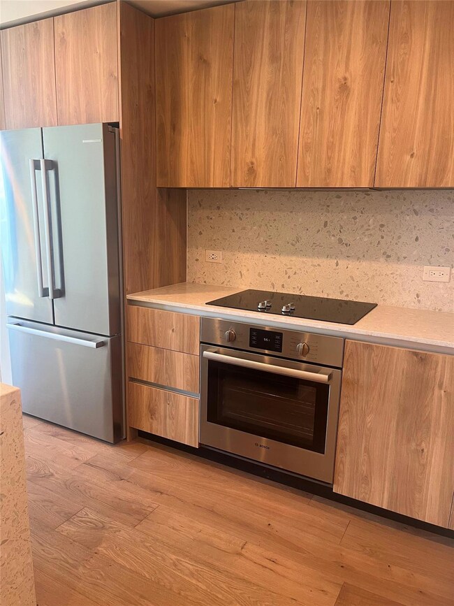 Kitchen featuring appliances with stainless steel