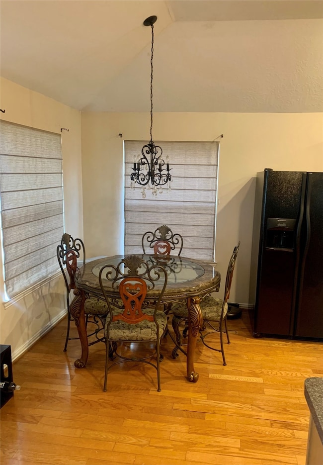Breakfast table area allows plenty of natural lighting and view of backyard