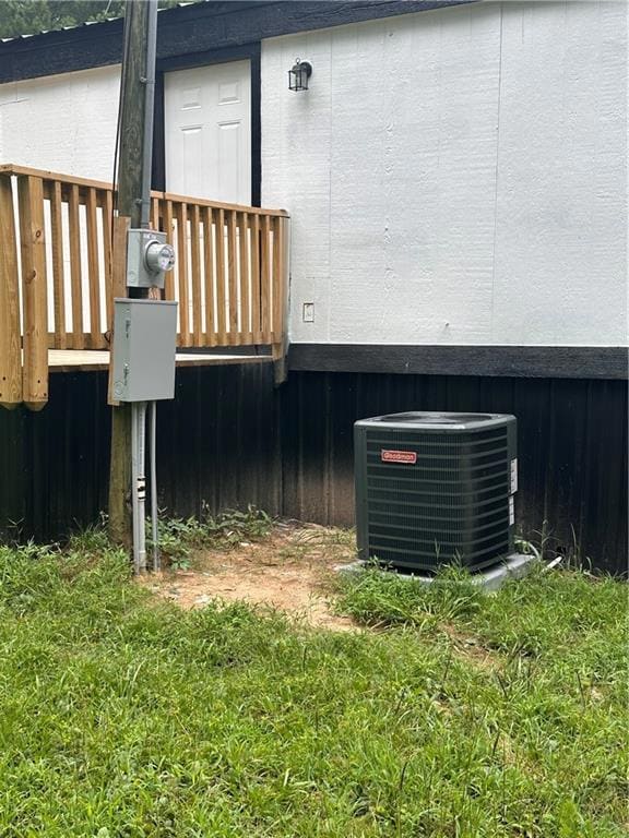 Exterior view of a central AC unit and electric meter