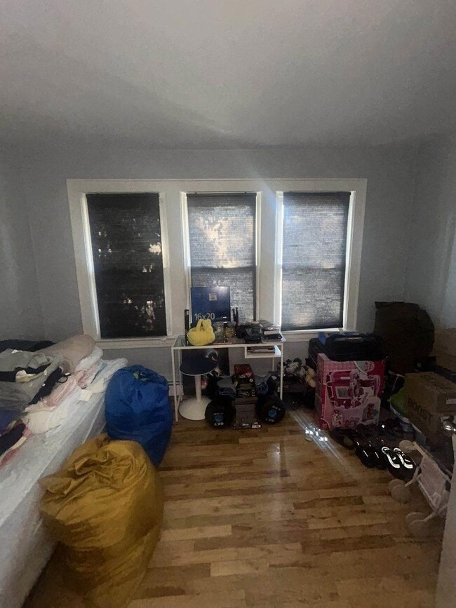 Bedroom with wood finished floors