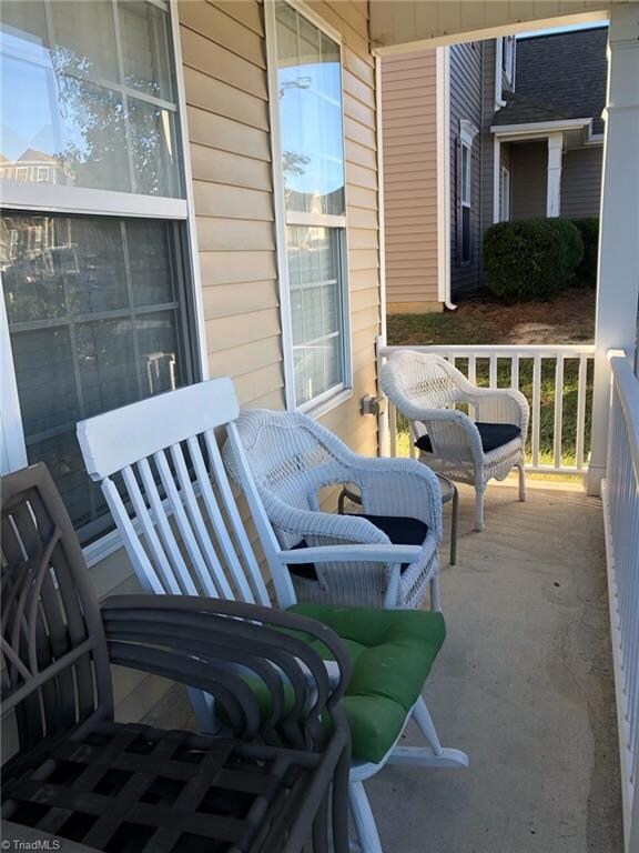 Relax on the covered front porch with freshly painted trim.