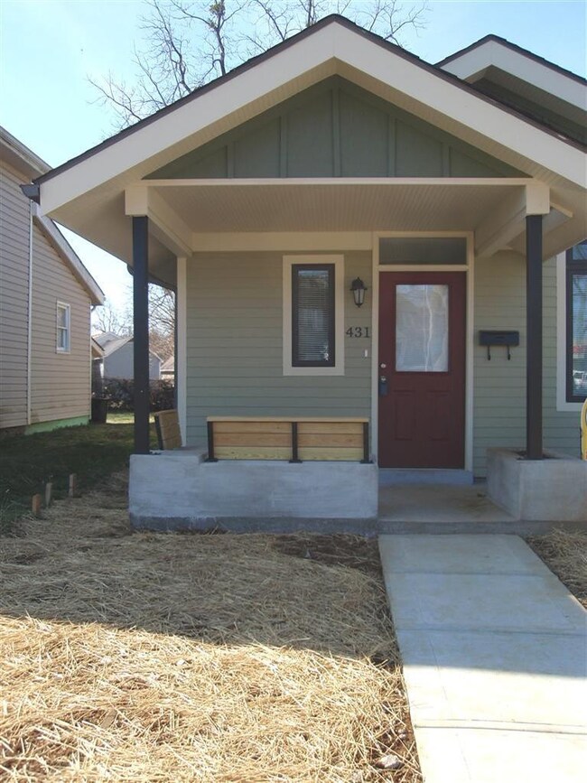 Cute as a button! Covered front porch wi
