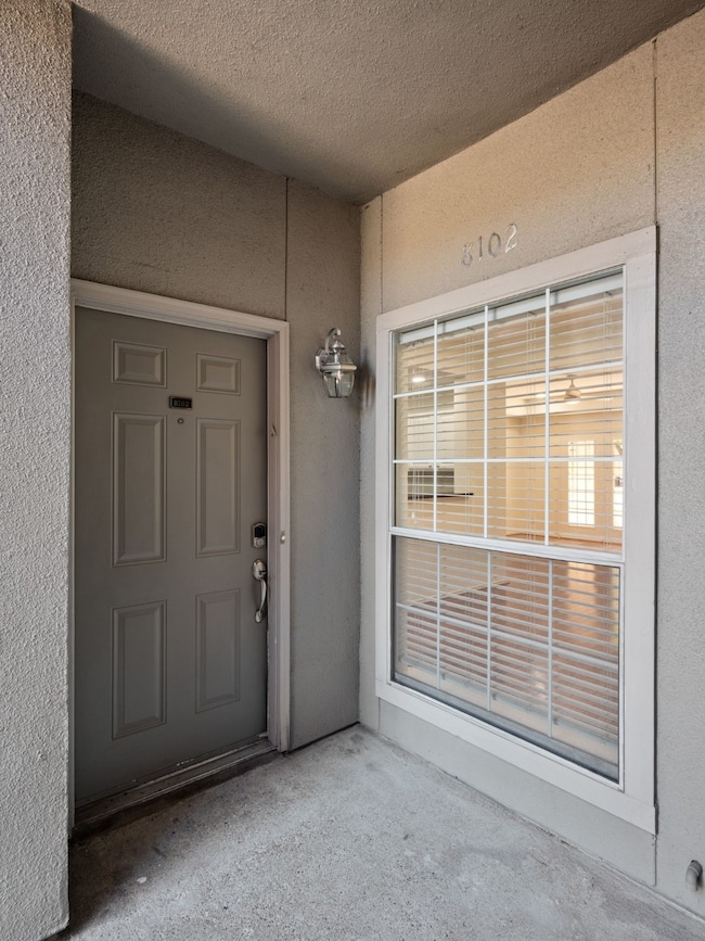 Property entrance with stucco siding