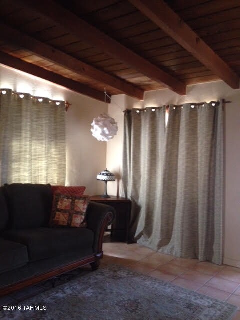 Living room with wood beam ceilings