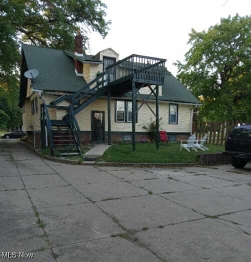 Back of house featuring a yard