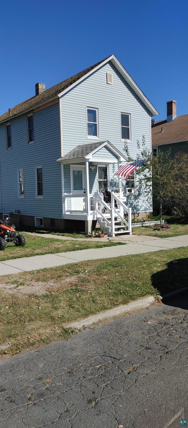View of front of house with a front lawn