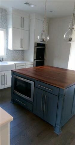 Extra large island contains extra cabinet space an