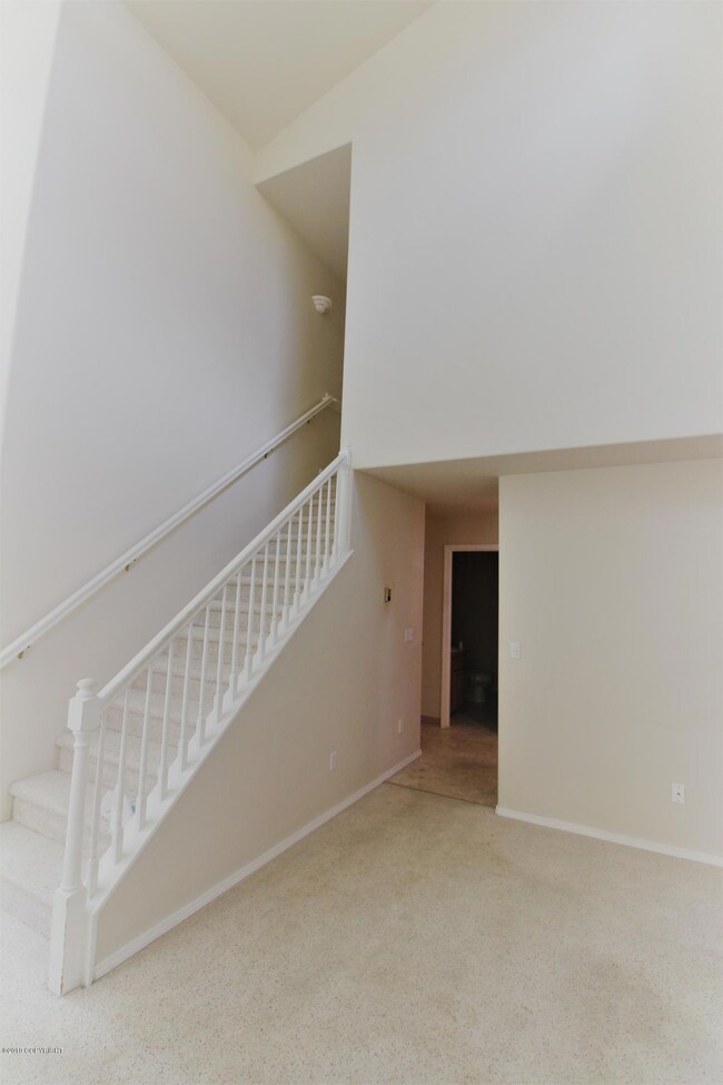 Going upstairs with a high ceiling