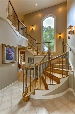 Stunning 2-story entry, gracious stairway with bea