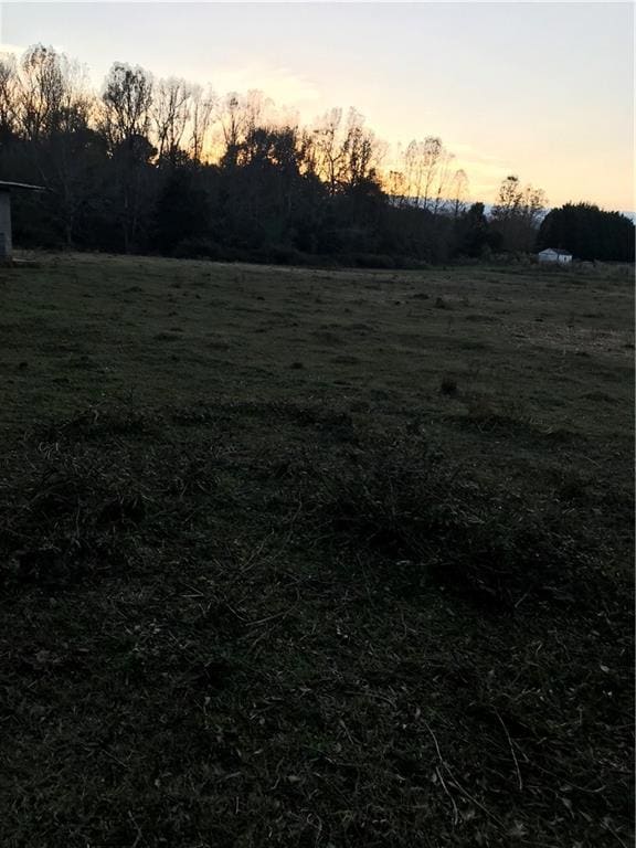 Yard at dusk with a rural view