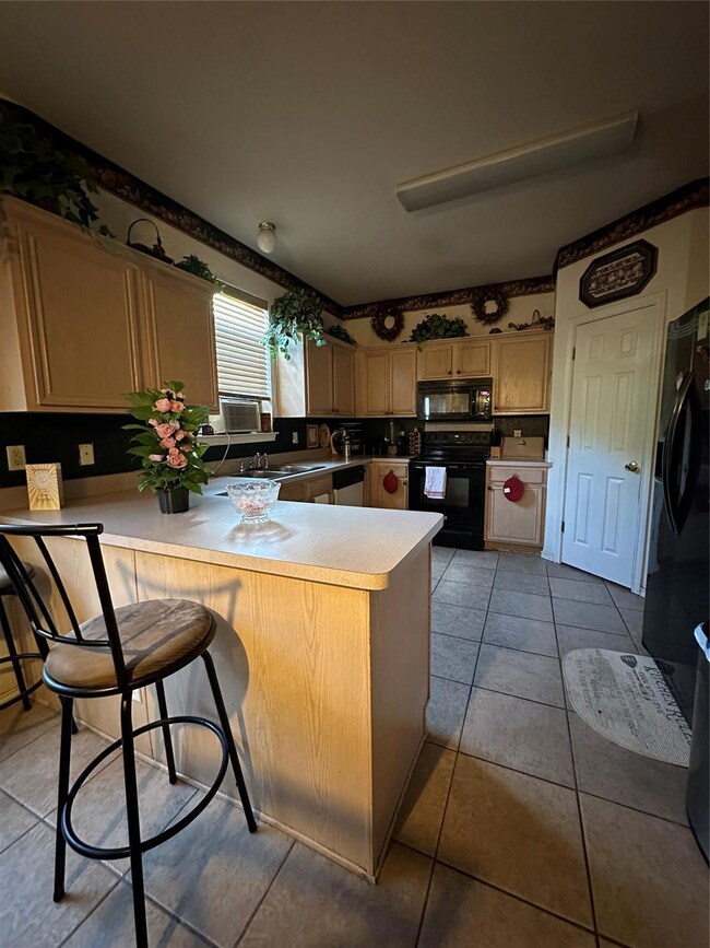 Kitchen with stove, tasteful backsplash, kitchen p