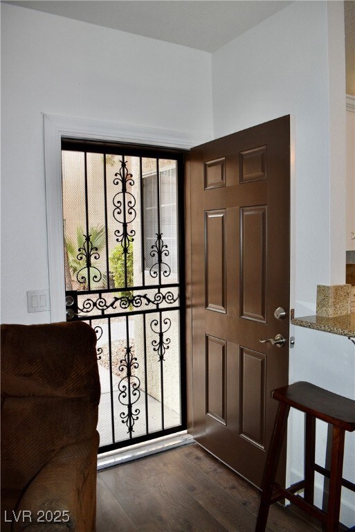 Entrance foyer with dark wood-type flooring